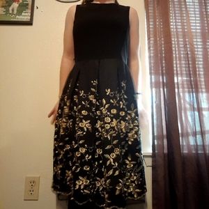 Black and gold sleeveless dress